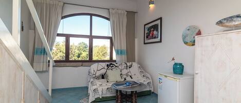 Family Apartment, Multiple Bedrooms (Bilo Porto Rotondo Castello 3) | Living area | 21-inch flat-screen TV with cable channels