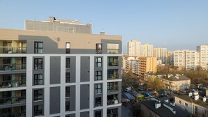 A multi-story residential building with balconies, large windows, and a flat roof. - ShortStayPoland Aleja Stanów Zjednoczonych (B159) (Warsaw)
