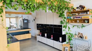 Enjoy cooking in this well-equipped kitchen with an oven, microwave, and ample counter space.
