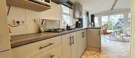 Dishwasher, coffee/tea maker, toaster, dining tables