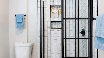 Shower, hair dryer, towels, shampoo