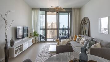 Design Apartment | Living area | 50-inch Smart TV with cable channels