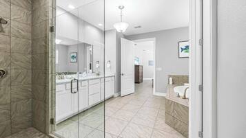 Shower, hair dryer, towels, shampoo