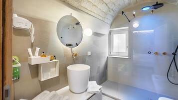 Deluxe Room | Bathroom | Shower, designer toiletries, hair dryer, bathrobes