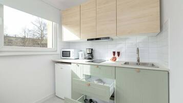 Fridge, microwave, stovetop, coffee/tea maker