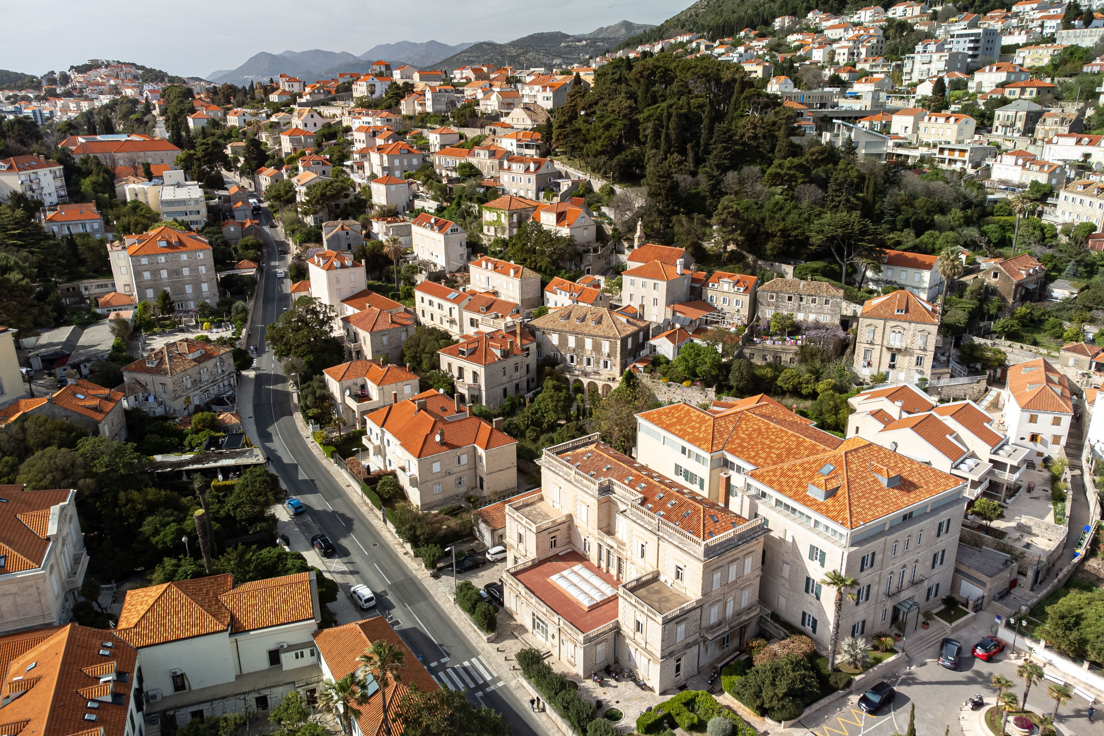 A densely packed urban area with historic buildings, narrow streets, and a mix of residential and commercial structures.