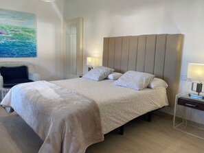 1 bedroom, desk, iron/ironing board, travel crib