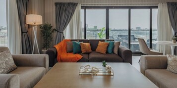 Apartment, 1 Bedroom | Living area | 55-inch flat-screen TV with satellite channels, TV, Netflix