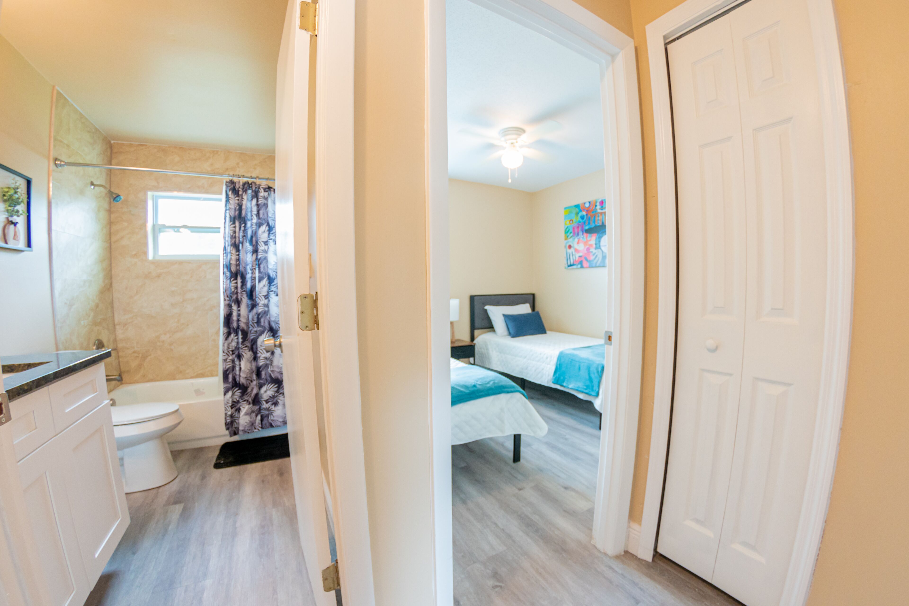 A bathroom with a toilet, shower, and a bathtub.