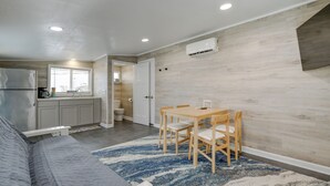 A compact living space with a kitchenette, a dining area, and a bedroom. - Angola Vacation Rental, Walk to Lake Erie Beach! (Angola)