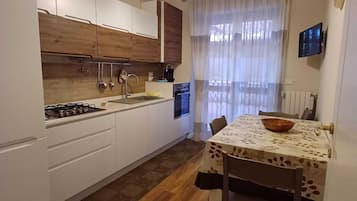 Apartment | Private kitchen | Full-sized fridge, microwave, oven, dishwasher