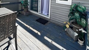 A two-story house with a deck, a sliding glass door, and a small outdoor seating area. - Mountain Oasis fo
Cozy & Peaceful View - Walk 2 All Seasons Resort - Fireplace (Sugar Mountain)