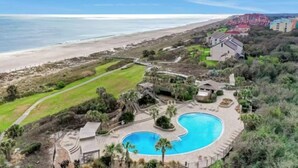 A resort with a large swimming pool, beachfront views, and a golf course. - 1164 Beach Walker - Adorable oceanfront, just steps to the beach and pool! (Fernandina Beach)