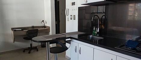 Fridge, microwave, coffee/tea maker, cookware/dishes/utensils