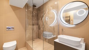 A modern bathroom with a glass-enclosed shower, a white sink, and a round mirror with illuminated rings. - Soubise, 1BR/1BA, 4 people (París)