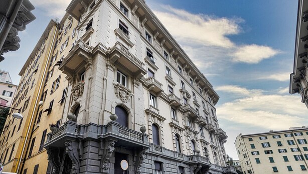 A historic building with classical architecture, multiple balconies, and ornate details. - Loft Garibaldi by Wonderful Italy (Genova)