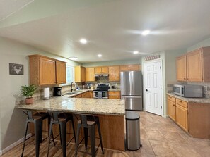 Fridge, microwave, oven, stovetop - Spacious Getaway Home in The Valley - Top Unit

 (West Valley City)