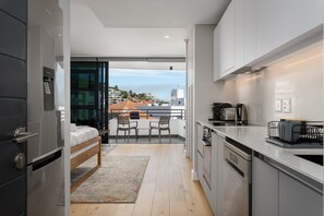 Fridge, microwave, oven, stovetop - Modern Bantry Bay Apartment - Ocean Views (Cape Town)