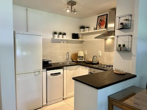 Apartment | Private kitchen | Fridge, oven, stovetop, dishwasher