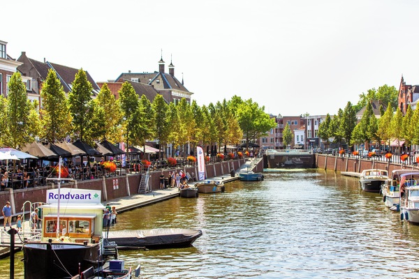 Breda, a picturesque city in Brabant, offers canal views, charming cafés, and vibrant riverside life.