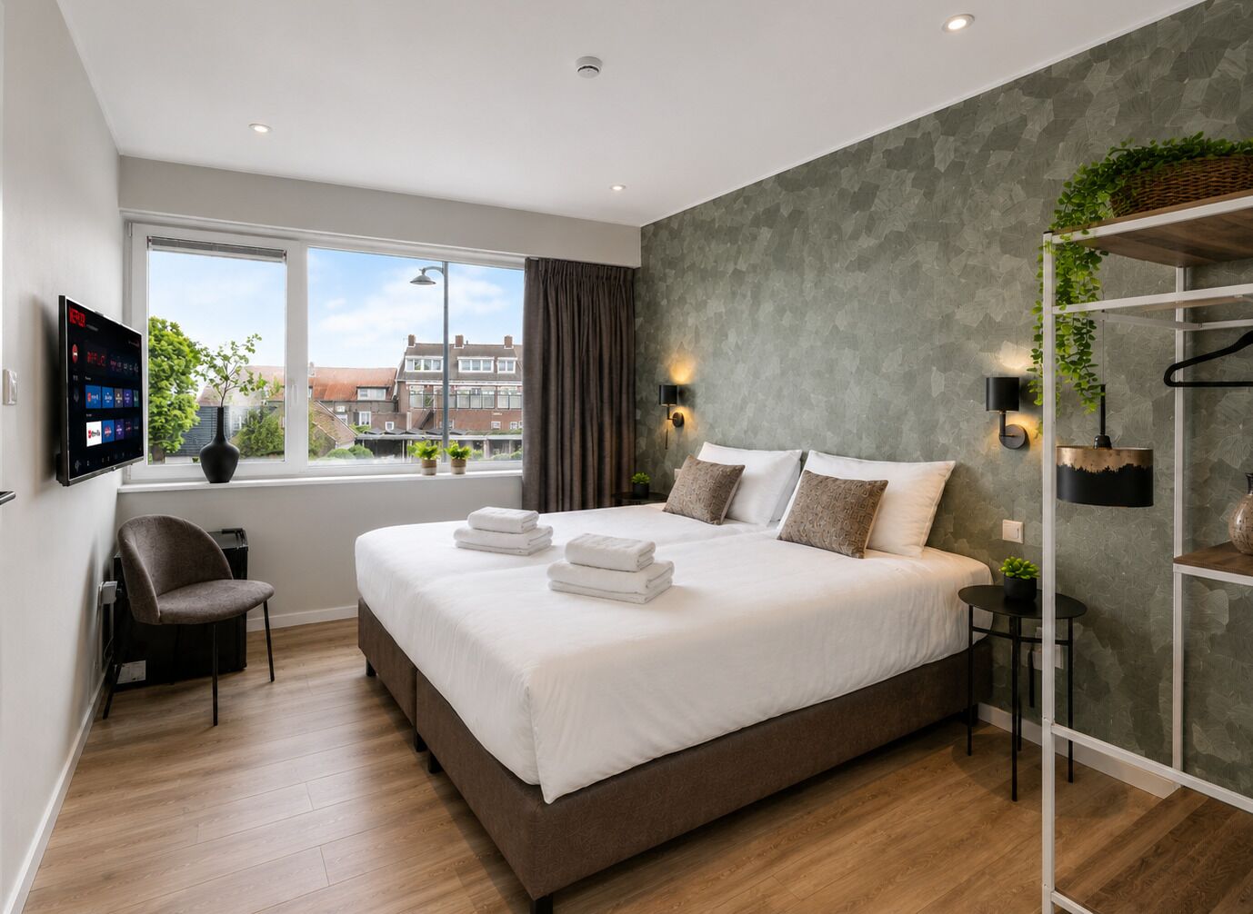 Enjoy hotel-style comfort with a cozy double bed, fresh linens, smart TV, and a bright, modern atmosphere.