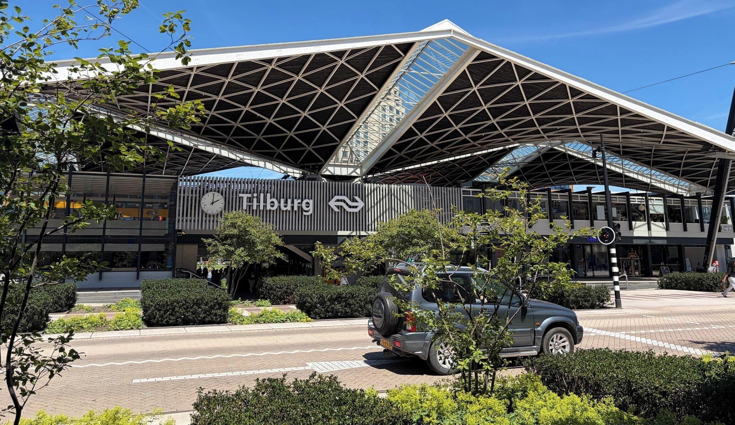 A modern building with a prominent sign reading 'Tilburg.'