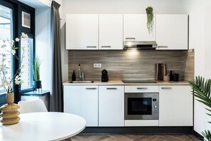Fridge, microwave, oven, stovetop - Contemporary studio featuring a private kitchen, bathroom, and two balconies (Tilburg)