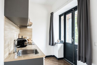 Modern space studio apartments near Hotel Central, ideal for lovers of refinement.