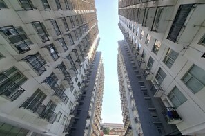 Stunning high-rise building with modern architecture and spacious balconies.