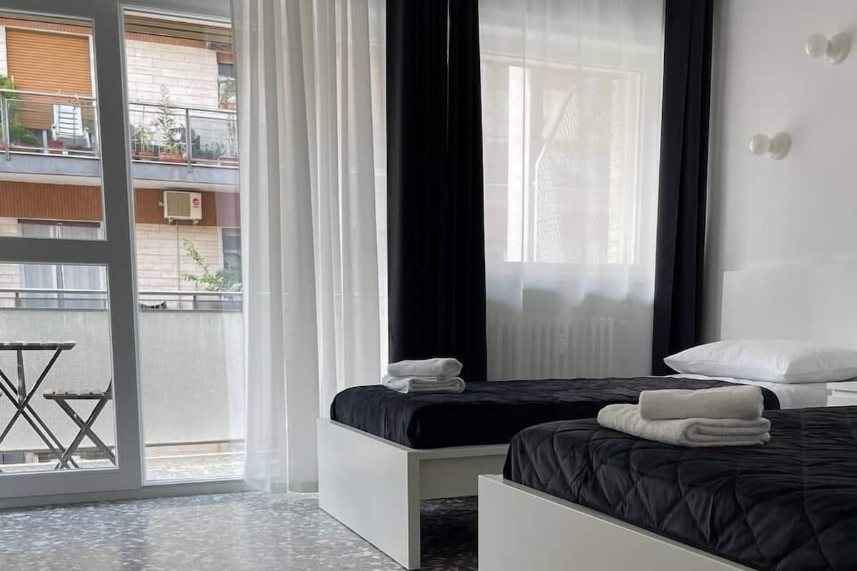 Family Room, City View | Down comforters, desk, laptop workspace