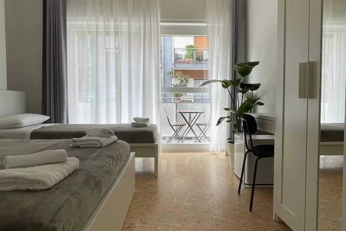 Classic Triple Room, City View | Down comforters, desk, laptop workspace