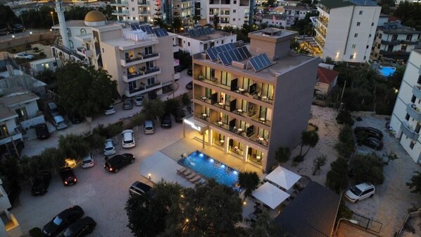 A multi-story hotel with a rooftop pool, solar panels, and a courtyard. - Resol Hotel 2 (Ksamil)