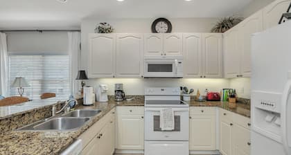 Long distance marsh views and community pool.