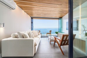 Business Apartment, Balcony, Ocean View | Living area | 50-inch LED TV with cable channels