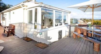 Large detached 3 bed bungalow. Great sea views. Hot tub with private gardens.