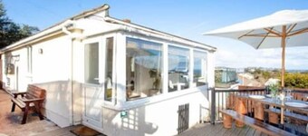 Large detached 3 bed bungalow. Great sea views. Hot tub with private gardens.