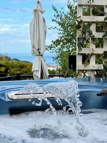 Large detached 3 bed bungalow. Great sea views. Hot tub with private gardens. 