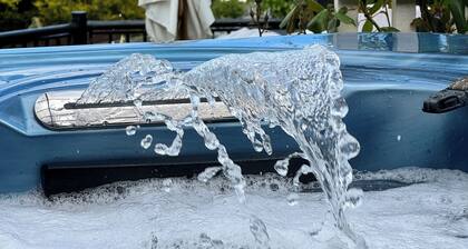 Large detached 3 bed bungalow. Great sea views. Hot tub with private gardens.