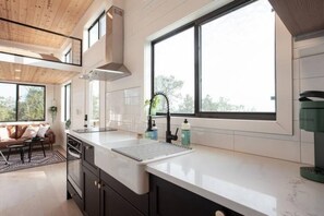 Fridge, stovetop, coffee/tea maker, cookware/dishes/utensils