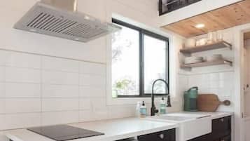 Fridge, stovetop, coffee/tea maker, cookware/dishes/utensils