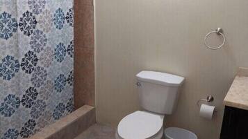 Shower, towels, soap, toilet paper