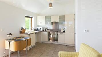 Fridge, microwave, toaster, cookware/dishes/utensils