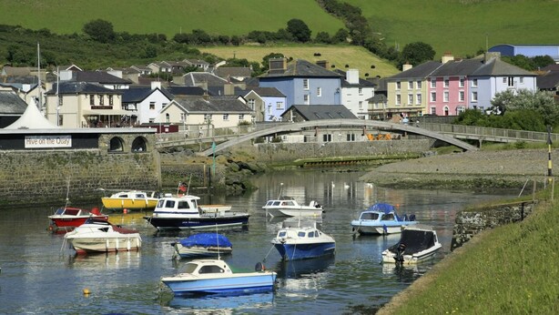 A coastal town with a stone bridge, colorful buildings, and boats docked along the water. - Swn y Mor, Aberaeron (Aberaeron)