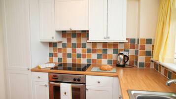 Fridge, microwave, toaster, cookware/dishes/utensils