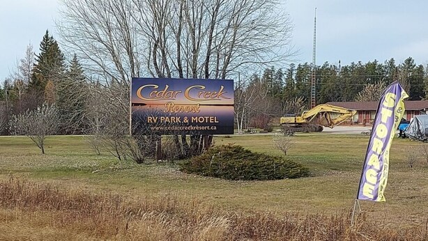 A sign for Cedar Creek RV Park & Motel with a website URL. - Cedar Creek Standard 1 (East Braintree)