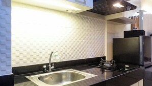 Studio | Private kitchen - Vibrant Modern Studio Room At Bale Hinggil Apartment (Surabaya)