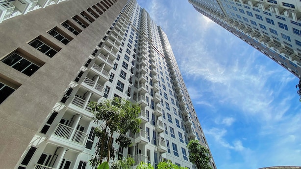 A high-rise building with multiple balconies and a clear sky. - Pleasurable And Tidy Studio At Tokyo Riverside Pik 2 Apartment (Teluknaga)