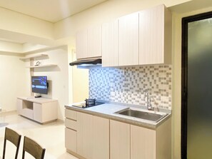 Apartment | Private kitchen | Fridge, stovetop, rice cooker - Serene Designed 2Br At Meikarta Apartment (Cikarang)