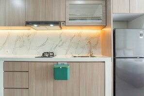 Monolocale | Cucina privata | Frigorifero, piano cottura, risottiera