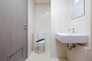 Studio | Bathroom | Shower, towels, soap, shampoo - Cozy Living Studio Tamansari Bintaro Mansion Apartment (South Tangerang)